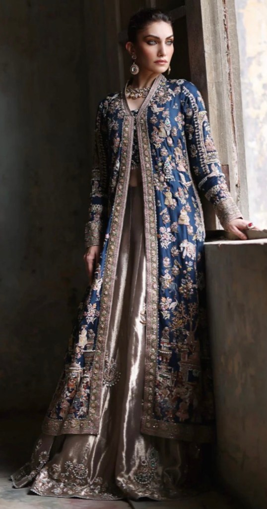 Navy blue embroidered long jacket paired with a champagne dress, luxury formal wedding fashion inspiration.