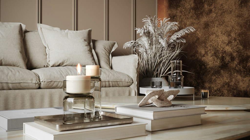 Neutral living room styled with candles and dried botanicals creating a calming winter scent atmosphere.