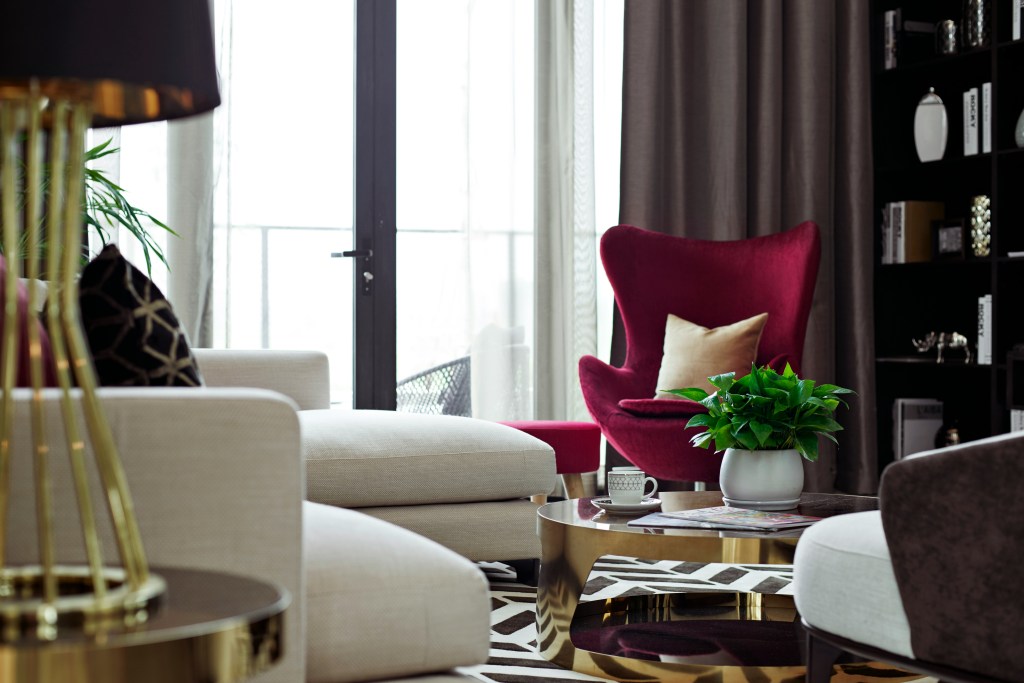 Statement lighting in a modern winter living room with plush seating, warm tones, and elegant decor.