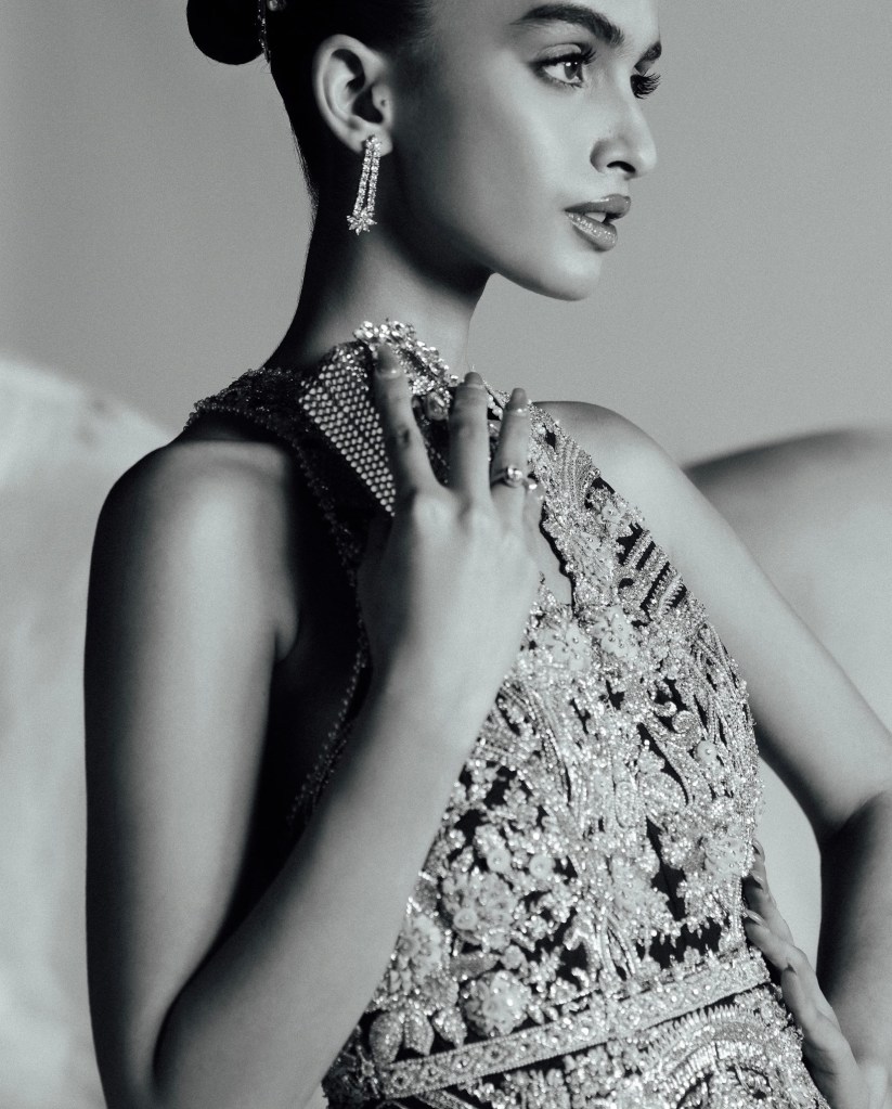 Black and white close-up of silver bridal beadwork showcasing detailed embroidery, texture, and couture craftsmanship.